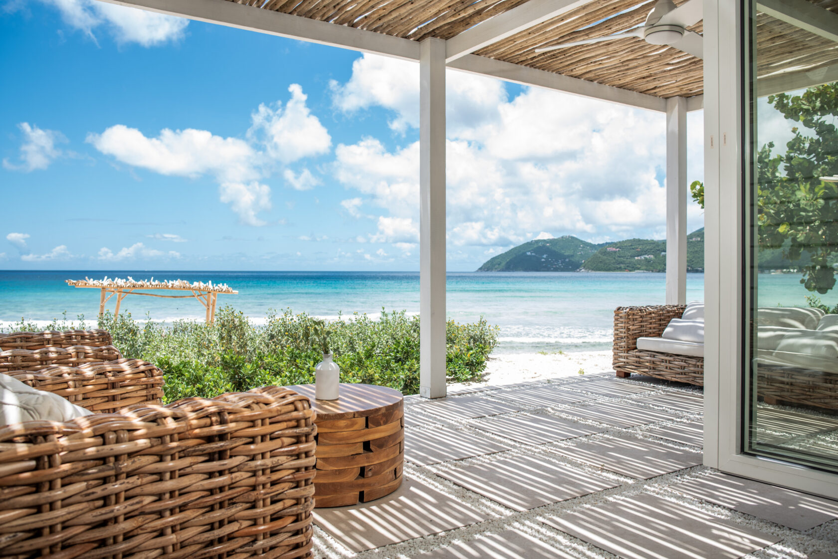 Beachside covered porch with views of the distant mountains
