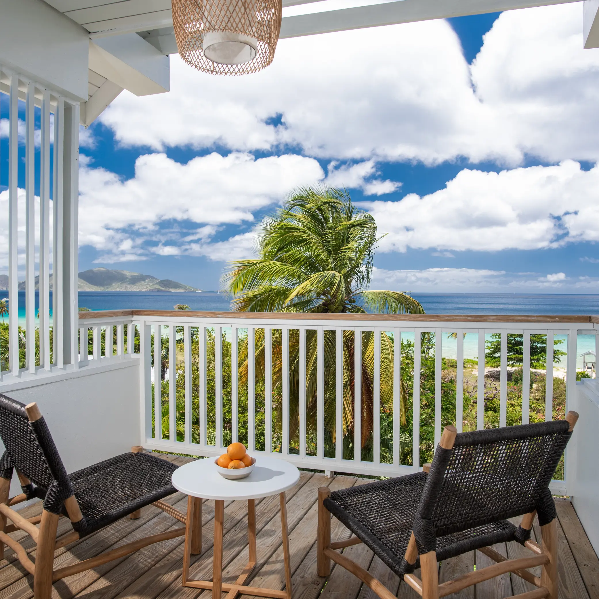 hillside accomodation overlooking the sweet tropical oasis of long bay beach resort and the Caribbean ocean